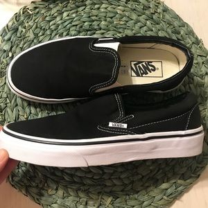 Vans black and white women’s slip on, size 8.